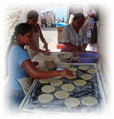 Girls making tortillas in San Antonio Palopo