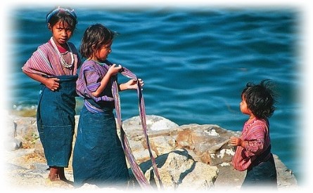 children on the shore of san antonio palopo lake atitlan