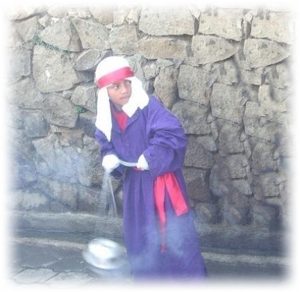 Boy carrying incense procession san antonio palopo